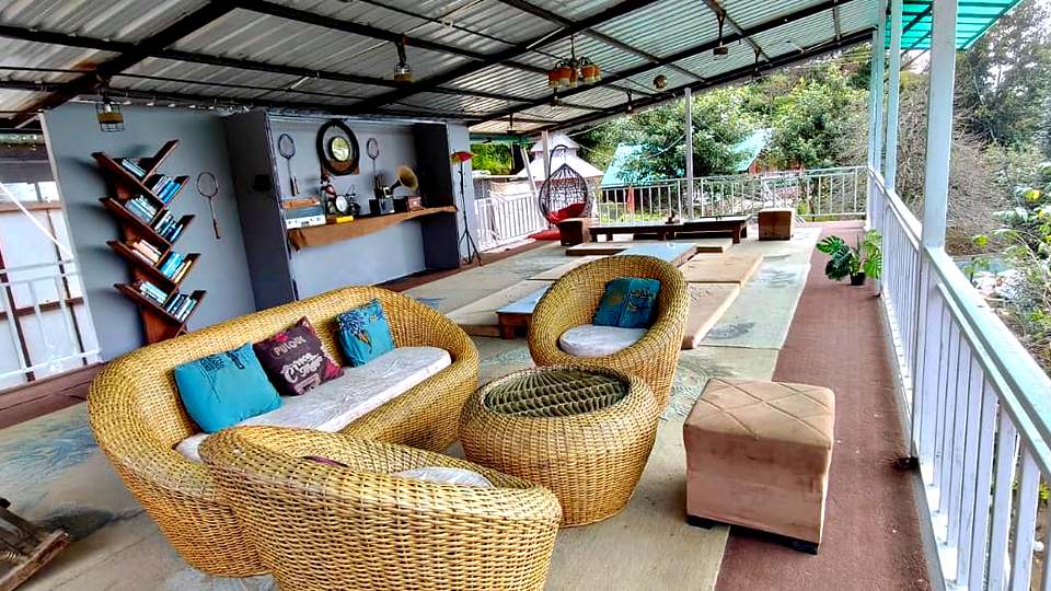Wicker sofa and cushions at the café lounge, The Rare One’s Resort, Mukteshwar