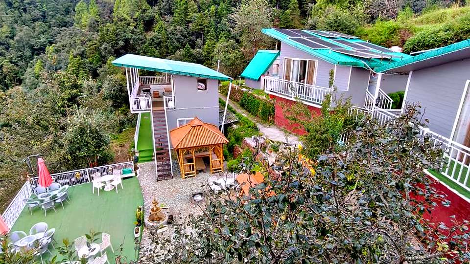 Hillside cottages, gazebo and lawn at The Rare One’s Resort, Mukteshwar