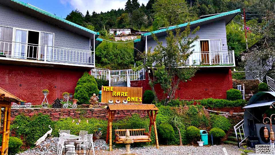 Rooms and cottages around the garden at The Rare One’s Resort, Mukteshwar