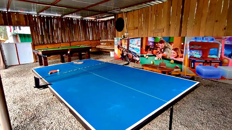 Table tennis in the game zone at The Rare One’s Resort, Mukteshwar