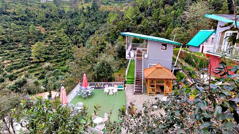 Terraced fields and forest in the valley below The Rare One’s Resort, Mukteshwar